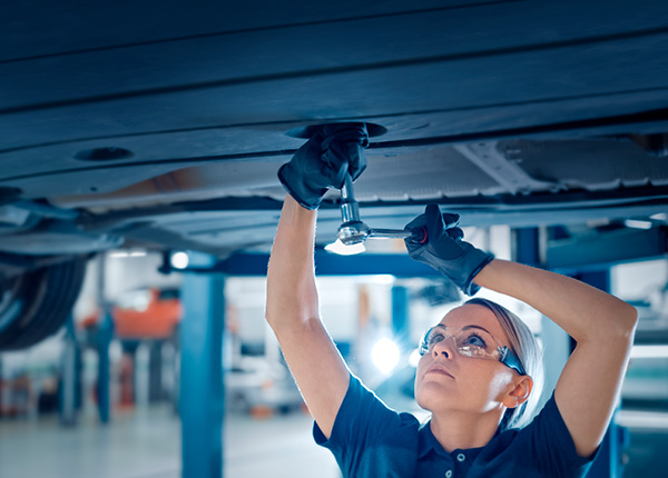 Female Car Mechanic working on a car