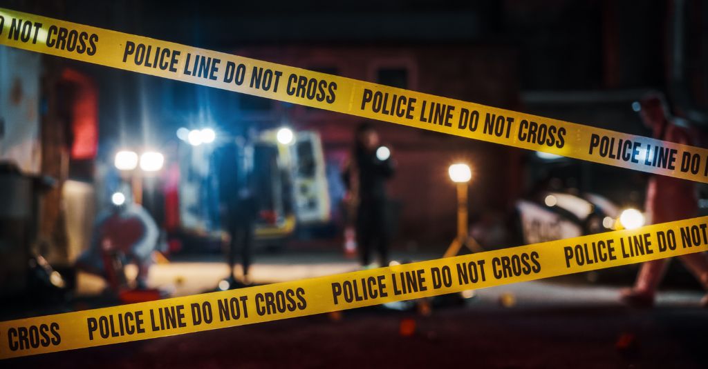 police line tape over a crime scene scenario