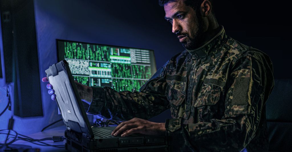military personnel at the command center using a rugged laptop