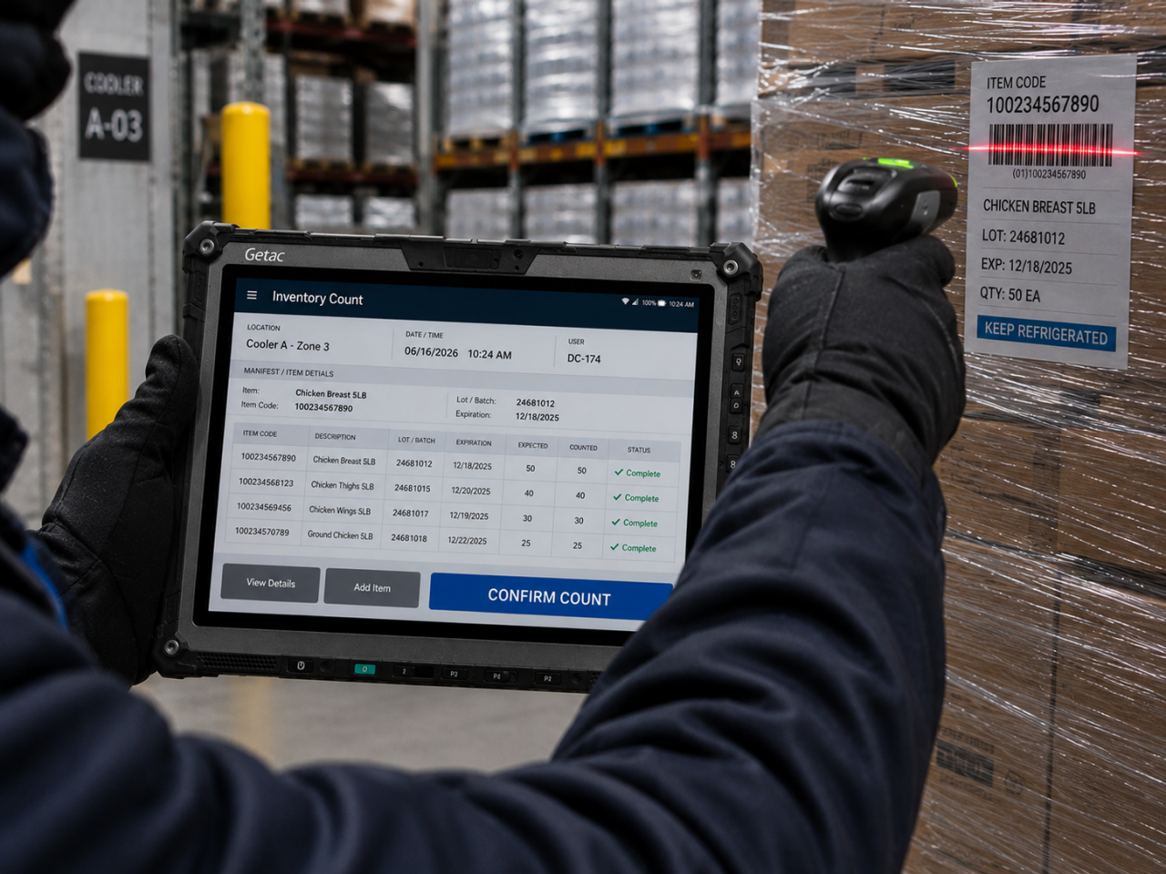 Worker scanning freight with a Getac rugged tablet in a cold-chain distribution environment